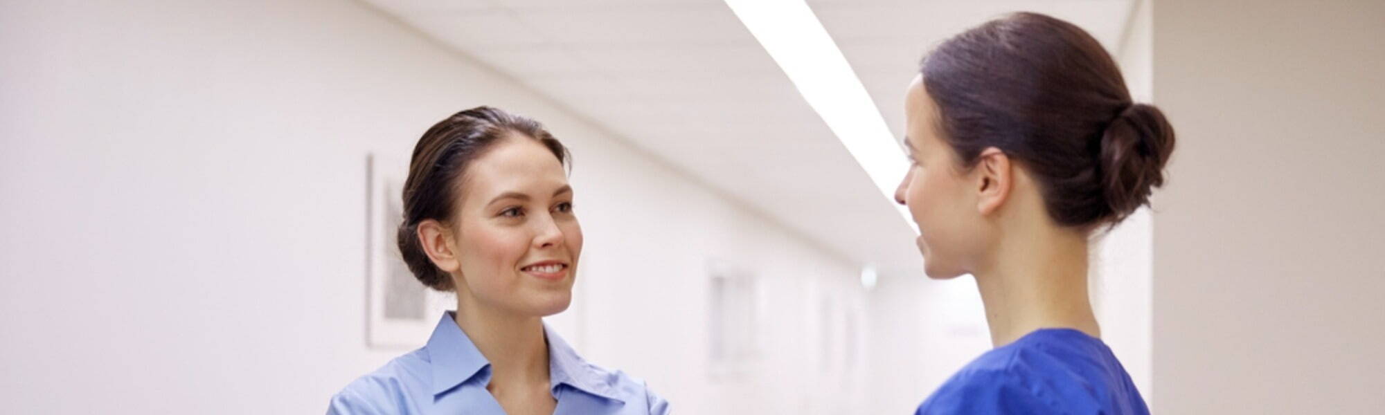 two nurses talking